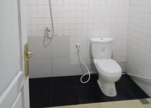 a bathroom with a toilet and a shower at Villa Kay View in Sampal 2