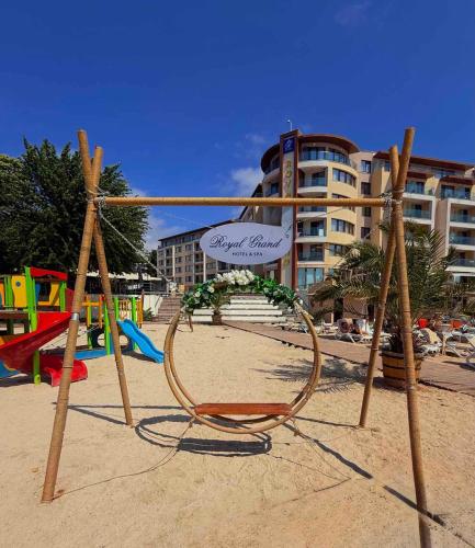 a swing in the sand at a beach at Royal Grand Hotel and Spa - All Inclusive and Free beach accsess in Kavarna