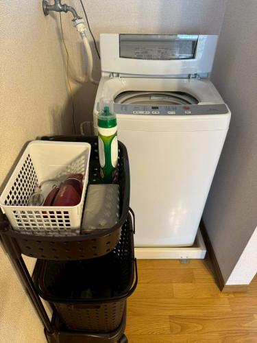 a washer and dryer sitting in a room at apartment hotel myu didymi in Utsunomiya