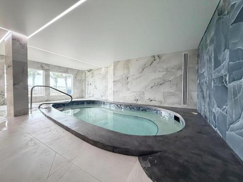 a large bathroom with a large tub in a room at The Summit 1426 in Panama City Beach