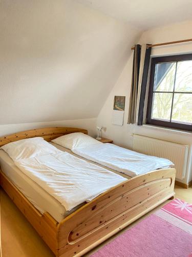 Postel nebo postele na pokoji v ubytování Finnhaus Andrea