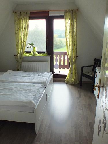 En eller flere senge i et værelse på Finnhaus Elke