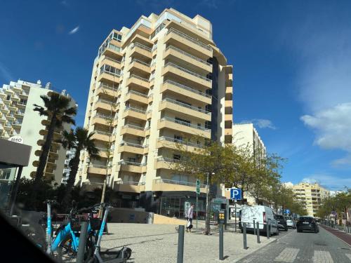 a tall building on the side of a city street at Rocha Atlantico in Portimão
