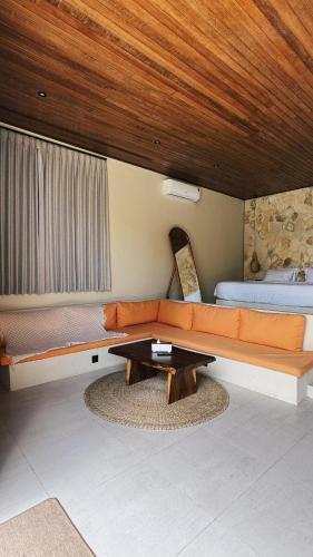 a living room with a couch and a table at Villa Saraswati I in Uluwatu