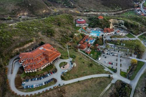 an aerial view of a house on a hill at Hotel Cascade Resort & Spa in Demjén