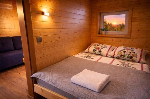 a small room with two beds in a cabin at Ośrodek Wypoczynkowy IGOR nad Jeziorem Żywieckim in Żywiec