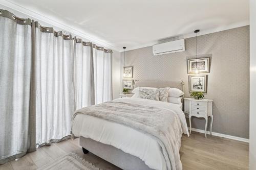 a bedroom with a large bed and a window at The Willow Cottage in Oakdale