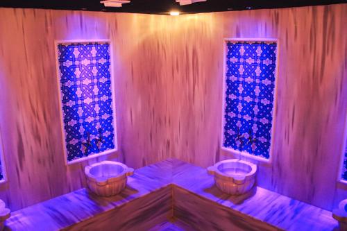 a room with two baskets and stained glass windows at Gelevera Park - Otel Spa Restaurant in Espiye
