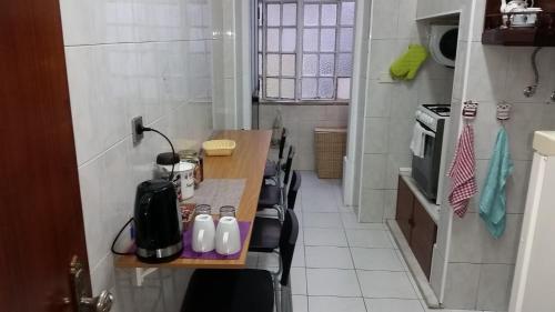 a small kitchen with a table and chairs in it at Hostel 15 in Lisbon