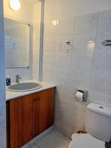 a bathroom with a toilet and a sink at Latchi Holiday House in Prodhromi