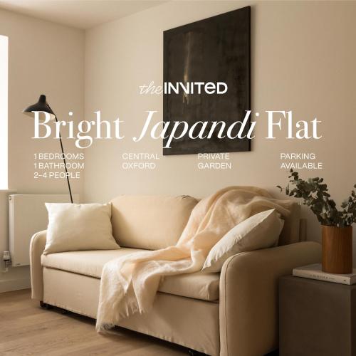 a living room with a couch in front of a magazine at Bright Japandi 1BR Flat with Garden - Central Oxford in Oxford