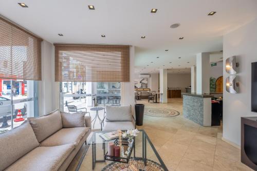 a living room with a couch and a table at Casa Alloro Bodrum in Bodrum City