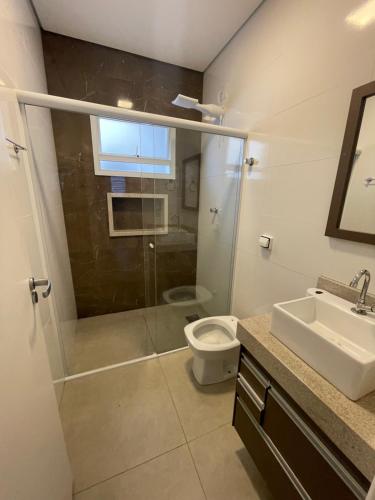 a bathroom with a shower and a toilet and a sink at Apartamento in Socorro