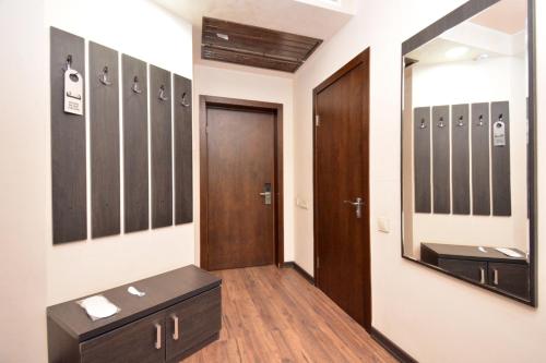 a dressing room with a mirror and a sink at Partez Hotel in Yerevan
