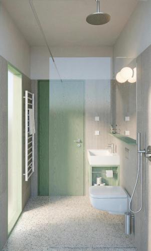 a bathroom with a shower and a toilet and a sink at Vila Soča in Bovec