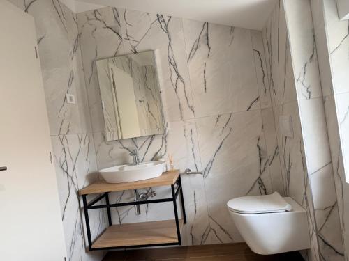 a bathroom with a sink and a toilet at Apartment Lasta Medulin in Medulin