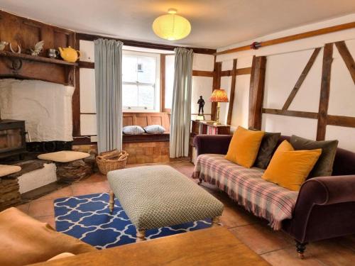a living room with a couch and a fireplace at 3 Bed in Kingsbridge oc-75138 in Bigbury