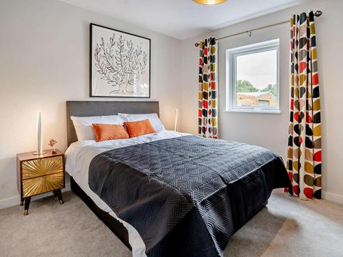 a bedroom with a large bed and a window at 3 Bed in Swansea oc-91722 in Killay