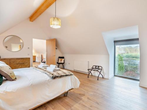 a bedroom with a large bed and a large window at 4 Bed in Aberdeen oc-93914 in Dyce