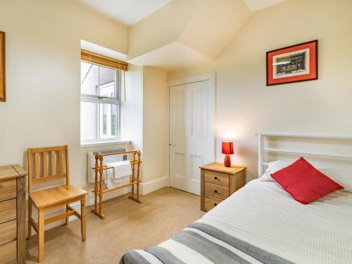 a bedroom with a bed and a desk and a chair at 3 Bed in Archiestown oc-ca227 in Carron