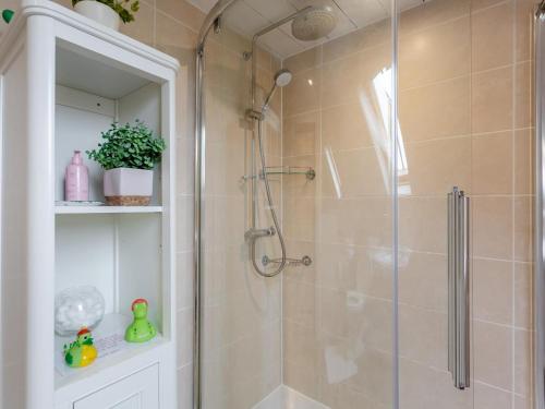 a bathroom with a shower with a glass door at 2 Bed in Drumnadrochit oc-ca315 in Drumnadrochit