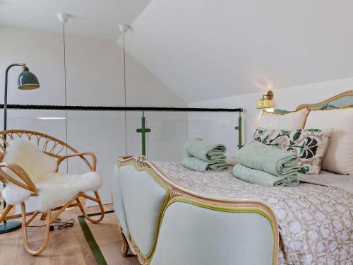 a bedroom with a bed and a chair at 1 Bed in Gateshead oc-95877 in Lamesley