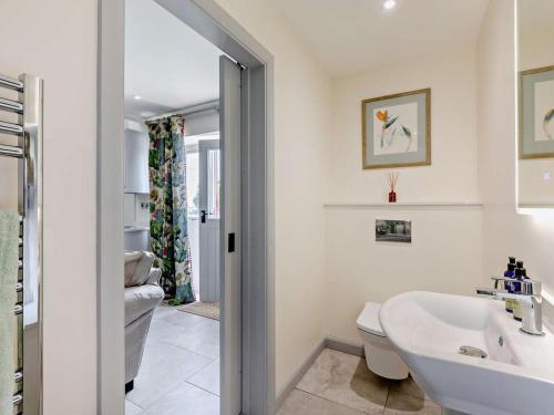 a bathroom with a sink and a toilet at 1 Bed in Gateshead oc-95877 in Lamesley