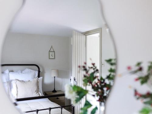 a bedroom with a bed and a mirror at 1 Bed in Sedbergh oc-g0182 in Milnthorpe