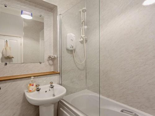 a bathroom with a sink and a glass shower at 1 Bed in Buckie oc-94536 in Cullen