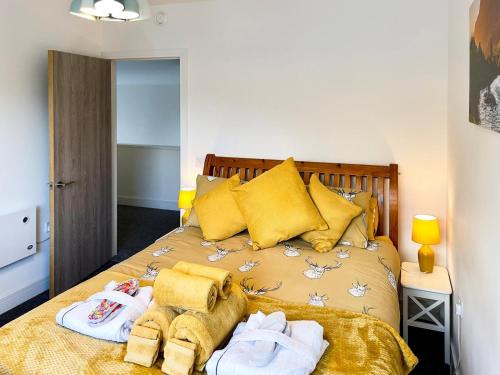 a bedroom with a bed with towels on it at 3 Bed in Kinlochleven oc-87130 in Kinlochleven