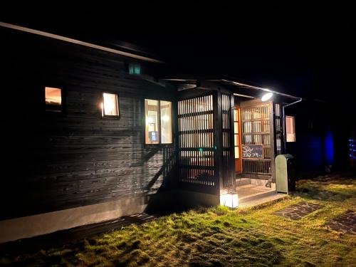 an open door of a house at night at ホシヤドリ hoshiyadori in Setouchi