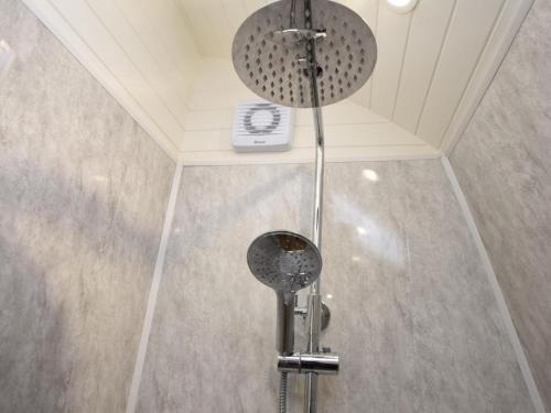 a shower head in a bathroom with a ceiling at 1 Bed in Hawick oc-75347 in Hawick