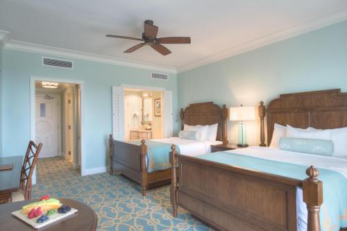 a hotel room with two beds and a table at Henderson Beach Resort in Destin