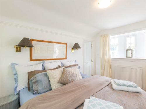 a bedroom with a large bed with pillows at 1 Bed in Brechin oc-ca217 in Edzell