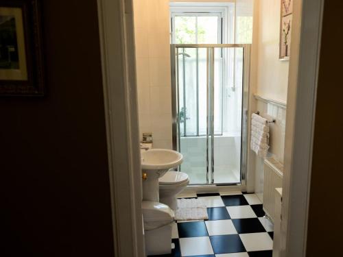 a bathroom with a toilet and a sink and a shower at 5 Bed in Lochgoilhead oc-ca279 in Carrick