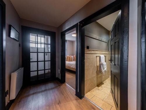 a hallway with a door leading to a bedroom at 3 Bed in Stranraer oc-77308 in Portpatrick
