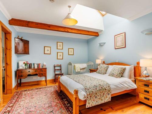 a bedroom with a bed and a desk at 8 Bed in Kirriemuir oc-ca261 in Kirriemuir