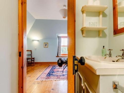 a bathroom with a sink and a mirror at 8 Bed in Kirriemuir oc-ca261 in Kirriemuir