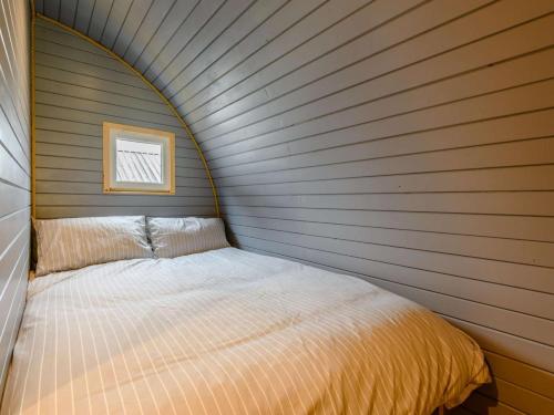 a small bedroom with a bed in a wall at 1 Bed in Coniston oc-88961 in Coniston