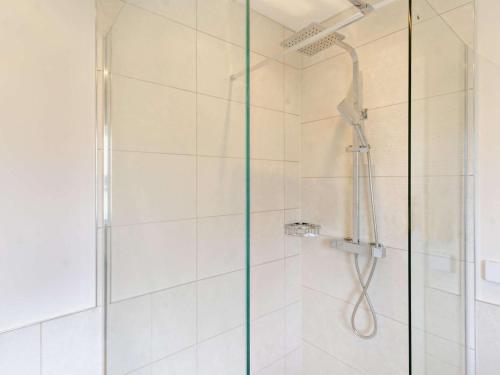 a shower with a glass door in a bathroom at 2 Bed in Swansea oc-91724 in Killay