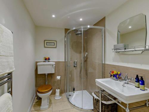 a bathroom with a shower and a toilet and a sink at 1 Bed in Hawick oc-91437 in Denholm
