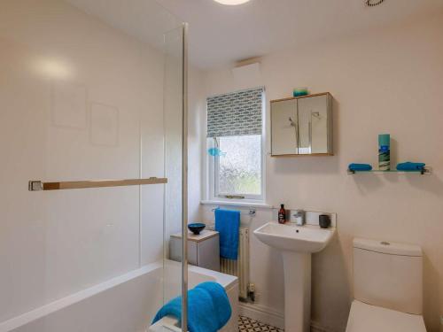 a bathroom with a toilet and a sink and a shower at 1 Bed in Northwich oc-91266 in Whitegate