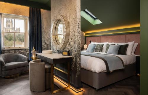 a bedroom with a large bed and a chair at Sanctuary Knocker in Durham