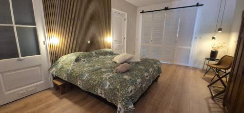 a bedroom with a bed in a room with a window at Spoor 24 in Dieren