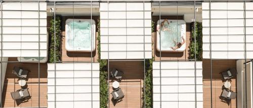 an overhead view of a building with a swimming pool at Nakar Hotel in Palma de Mallorca