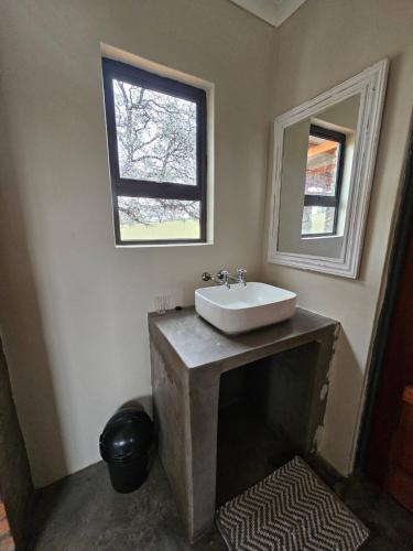 a bathroom with a sink and a window at Troupant - Luxury Bush Unit in Askham
