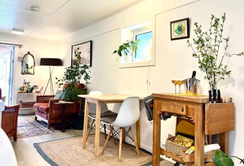 a living room with a table and a desk at Lily s Pad - Private retreat in Lymington, New Forest in Lymington