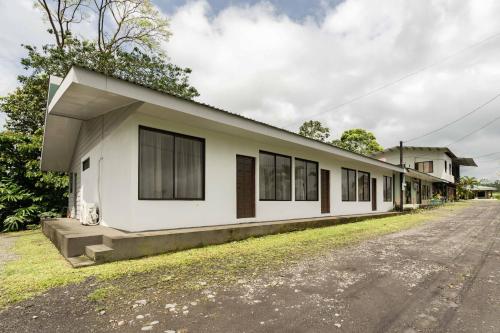 a white building on the side of a street at Catalinas Cozy Room in Fortuna