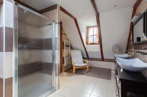 a bathroom with a shower and a sink at L'Ancienne Poste Exclusive Alpine Chalet in Avajan