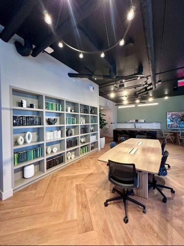 an office with a table and chairs in a room at 501 First Residences Miami in Miami